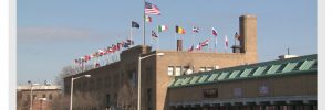 Erie News Now Flags Raised Atop Logistics Plus Buliding